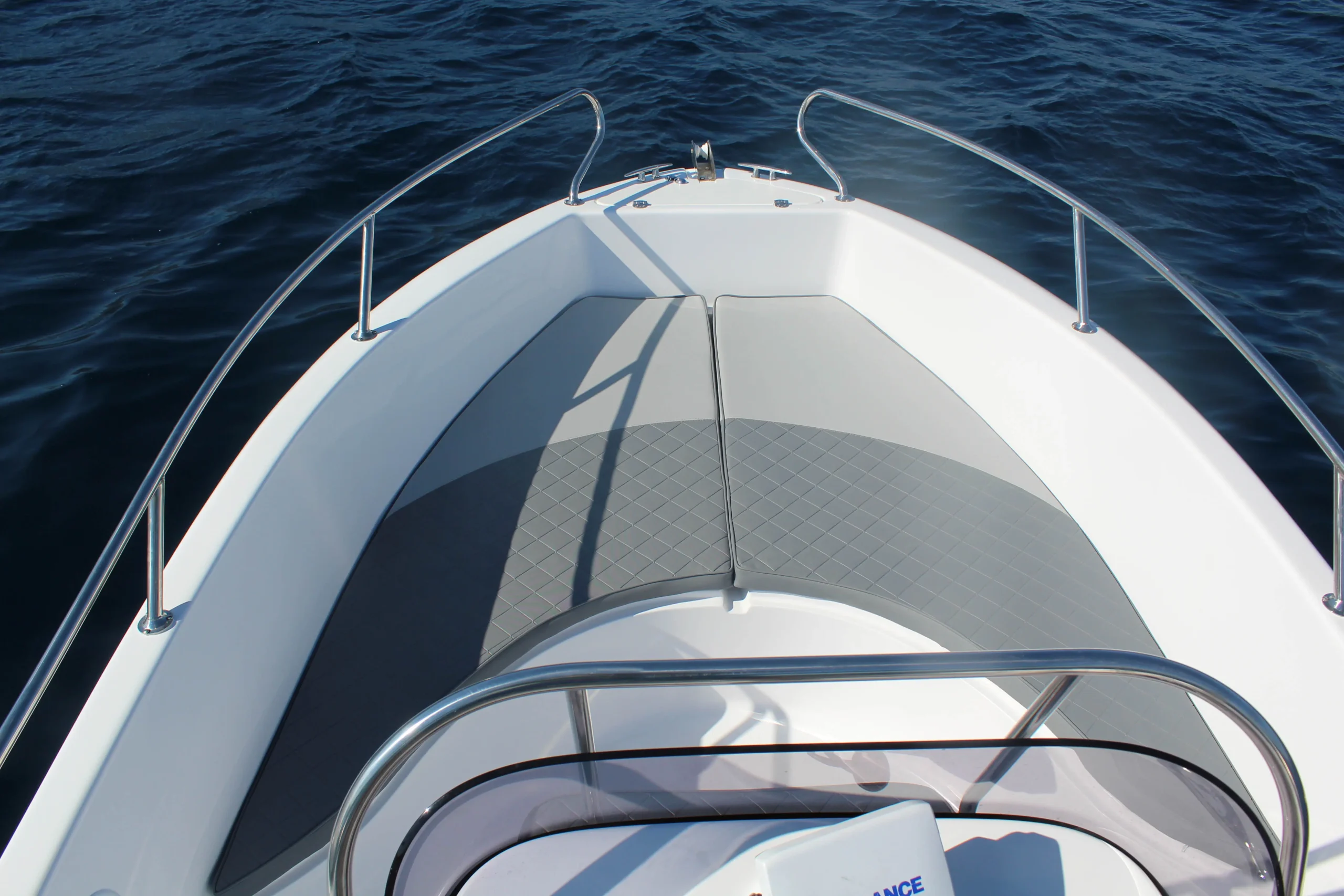 Bow seating and sunbathing area of the Saver 19 rental boat