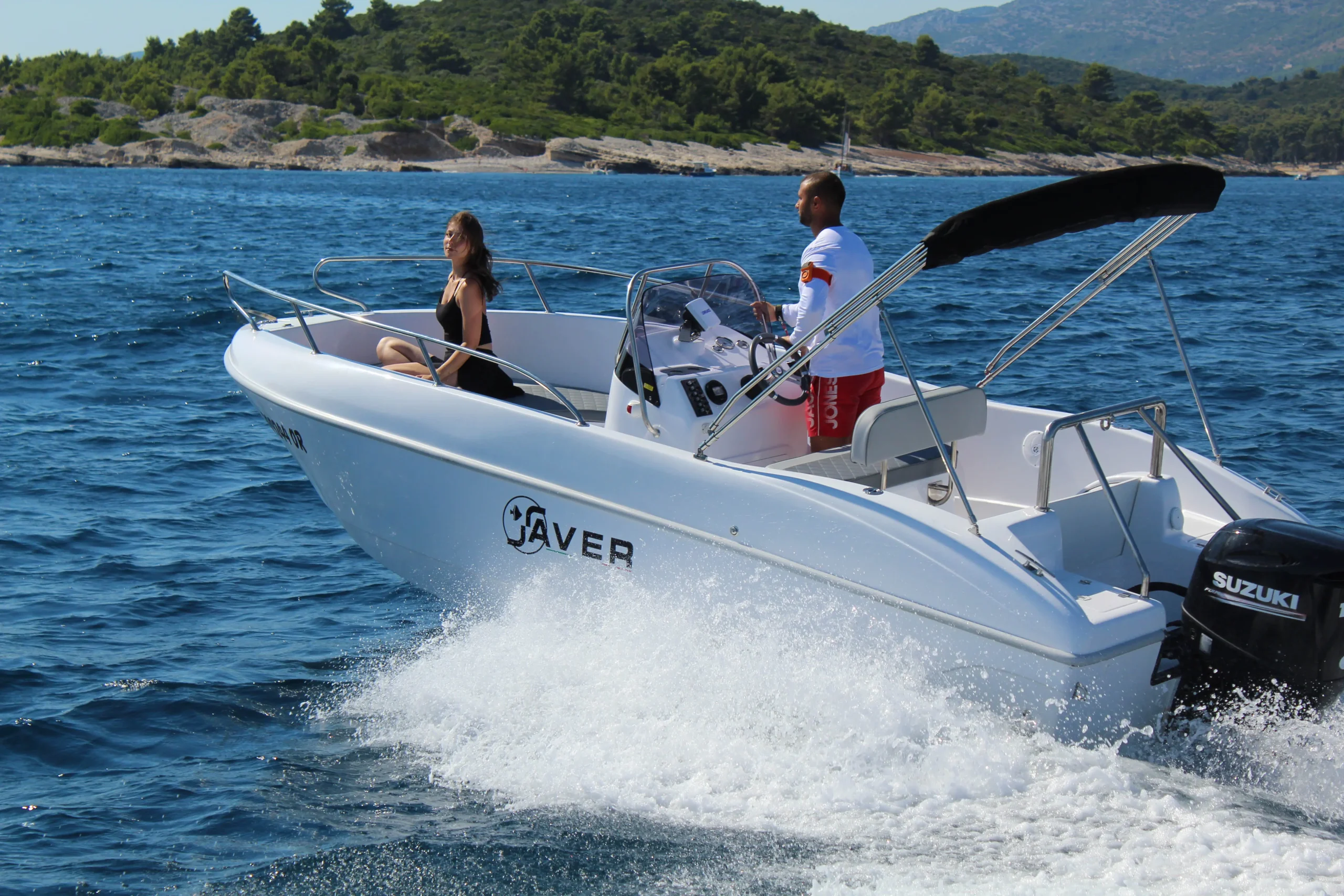 Saver 19 rental boat cruising along the coastline near Orebic