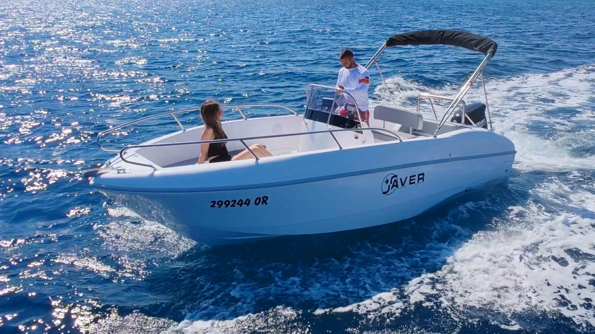 Side view of the Saver 19 rental boat cruising near Orebic